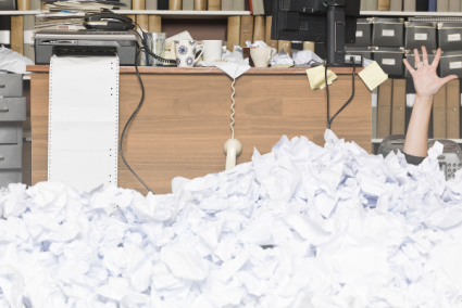 Office with wads of paper overflowing