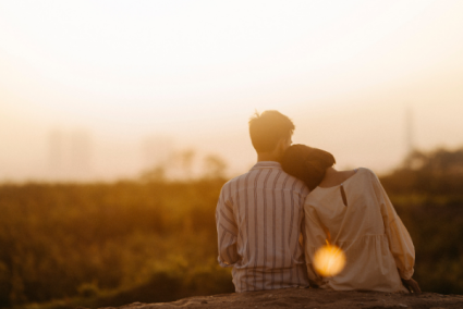 Couple embracing watching a sunset