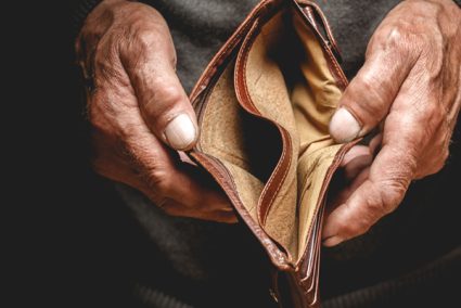 Person displaying an open faced empty wallet
